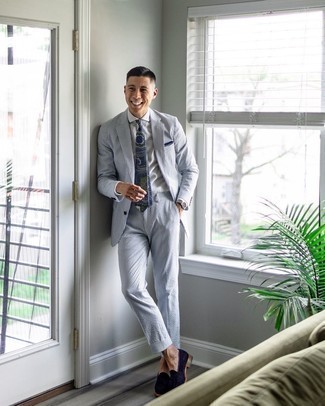 Navy and White Vertical Striped Suit Outfits: A navy and white vertical striped suit and a white dress shirt are a seriously dapper outfit for any gentleman to try. A pair of navy suede tassel loafers looks perfect finishing your outfit.