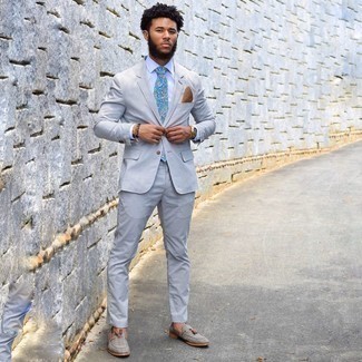 Light Blue Tie Outfits For Men: Irrefutable proof that a light blue vertical striped seersucker suit and a light blue tie look awesome when married together in a polished look for a modern man. Feeling creative? Shake up your ensemble by rounding off with grey canvas tassel loafers.
