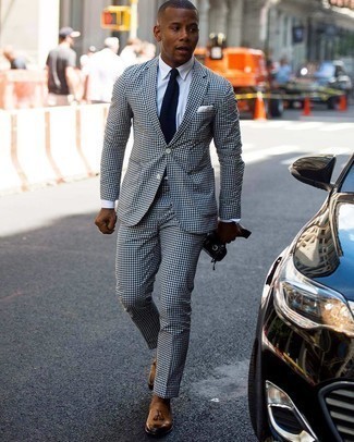 Blue Knit Tie Outfits For Men: A white and black gingham suit and a blue knit tie are absolute mainstays if you're figuring out a dapper wardrobe that holds to the highest men's fashion standards. Complete this outfit with a pair of tobacco leather tassel loafers to avoid looking overdressed.