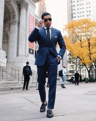 Navy Suit Outfits: Marry a navy suit with a white dress shirt for a neat sophisticated ensemble. Unimpressed with this outfit? Invite black leather tassel loafers to shake things up.
