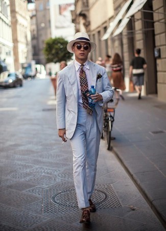 Light Blue Vertical Striped Suit Outfits: You'll be surprised at how very easy it is to pull together this elegant outfit. Just a light blue vertical striped suit and a white vertical striped dress shirt. The whole look comes together perfectly if you complement this outfit with a pair of dark brown leather tassel loafers.