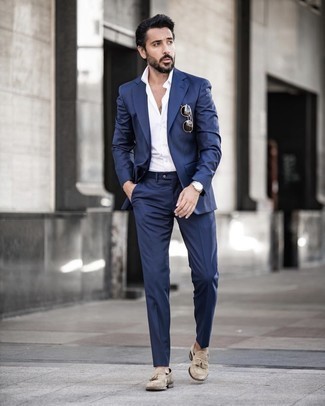 Navy Suit Outfits: Wear a navy suit and a white dress shirt for a seriously dapper outfit. When this getup appears too dressy, play it down by rounding off with beige suede tassel loafers.