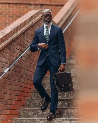 Black Leather Briefcase Outfits: This combination of a navy suit and a black leather briefcase embodies comfort and effortless menswear style. For something more on the classy end to complete your outfit, add dark brown leather tassel loafers to this ensemble.