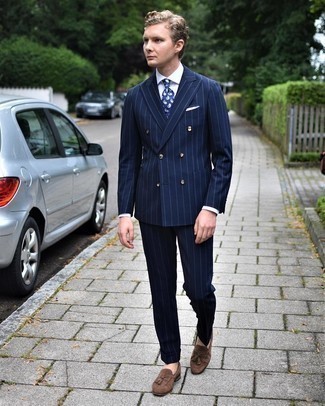 Blue Paisley Tie Outfits For Men: A navy vertical striped suit and a blue paisley tie are a refined getup that every smart gentleman should have in his sartorial collection. Inject a dose of stylish nonchalance into this look by finishing off with a pair of brown suede tassel loafers.
