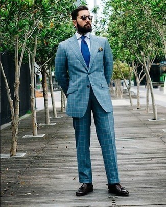 Blue Tie Outfits For Men: A blue check suit and a blue tie are absolute staples if you're crafting a refined wardrobe that holds to the highest men's style standards. Complement this look with dark brown leather tassel loafers to make a standard getup feel suddenly fun and fresh.