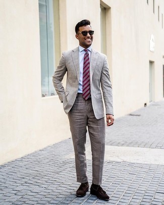Red Tie Outfits For Men: You're looking at the solid proof that a grey linen suit and a red tie look amazing when paired together in a sophisticated outfit for a modern guy. Dress down your outfit with dark brown suede tassel loafers.