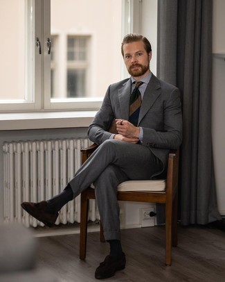Charcoal Suit Outfits: Dress in a charcoal suit and a white and navy vertical striped dress shirt and you'll ooze class and refinement. Dark brown suede tassel loafers are a great option to finish this look.
