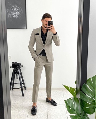 Black Dress Shirt Outfits For Men: Wear a black dress shirt with a grey vertical striped suit if you're going for a clean, stylish ensemble. All you need is a great pair of charcoal leather tassel loafers to complement this look.