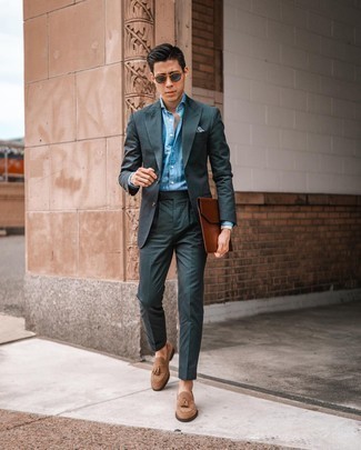 Brown Suede Tassel Loafers Outfits: A dark green vertical striped suit and a light blue chambray dress shirt are absolute mainstays if you're figuring out a classy wardrobe that holds to the highest men's fashion standards. The whole ensemble comes together if you add a pair of brown suede tassel loafers to the mix.