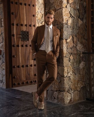 Brown Suit Outfits: A brown suit looks especially classy when paired with a white dress shirt in a modern man's outfit. Ramp up your whole ensemble by wearing a pair of beige suede tassel loafers.