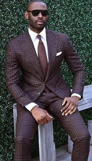 Dark Brown Polka Dot Tie Dressy Outfits For Men: This pairing of a dark brown plaid suit and a dark brown polka dot tie is a foolproof option when you need to look like a modern gent.
