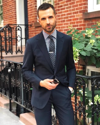 Black Dress Shirt Outfits For Men: This refined combo of a black dress shirt and a navy suit is undoubtedly a statement-maker.