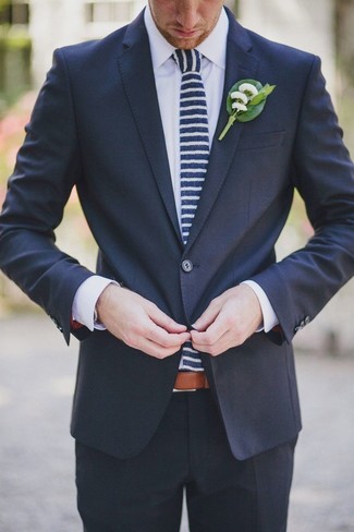 Green Lapel Pin Warm Weather Outfits: This casual pairing of a navy suit and a green lapel pin is a winning option when you need to look stylish but have zero time.