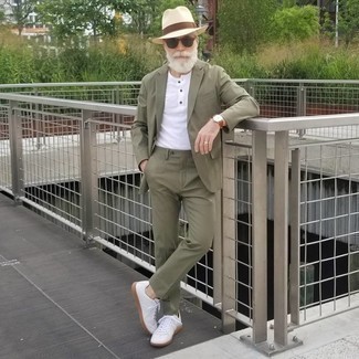 Olive Suit Outfits: An olive suit and a white henley shirt are a wonderful pairing that will get you a great deal of attention. A pair of white canvas low top sneakers brings a more dressed-down aesthetic to the outfit.