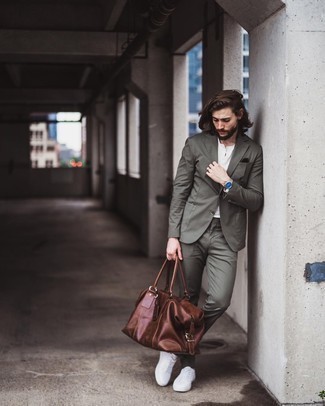 Olive Suit Outfits: Team an olive suit with a white henley shirt for a sleek elegant menswear style. White canvas low top sneakers are the most effective way to upgrade your getup.