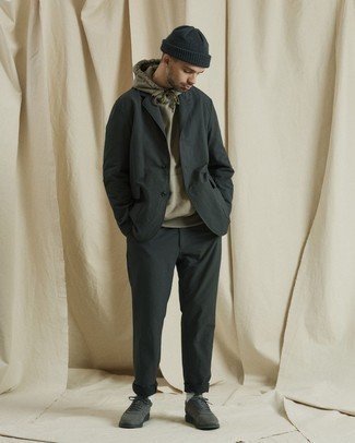 Dark Green Suit Outfits: For a look that's street-style-worthy and effortlessly smart, reach for a dark green suit and a tan hoodie. Finishing off with a pair of charcoal canvas low top sneakers is a guaranteed way to inject a dose of stylish effortlessness into this ensemble.