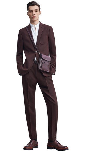 Burgundy Leather Messenger Bag Outfits: This combination of a dark brown suit and a burgundy leather messenger bag is hard proof that a safe casual ensemble can still be incredibly sharp. Here's how to dial it up: dark brown leather derby shoes.