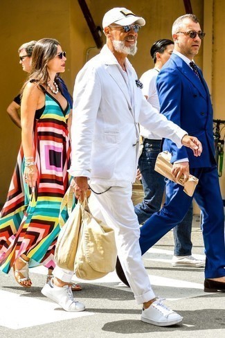 White Linen Suit Outfits: Undeniable proof that a white linen suit and a white linen long sleeve shirt are amazing when teamed together in a sophisticated ensemble for a modern guy. Add a more casual twist to with white leather low top sneakers.