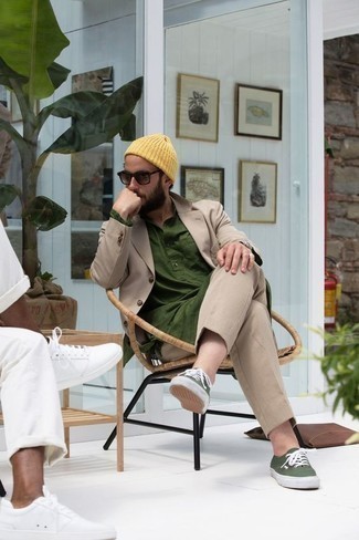 Yellow Beanie Outfits For Men: Such pieces as a tan suit and a yellow beanie are the ideal way to inject extra cool into your day-to-day lineup. Look at how great this ensemble pairs with olive canvas low top sneakers.