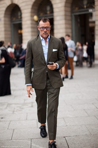 Monks Outfits: This is undeniable proof that a brown suit and a light blue long sleeve shirt look awesome when paired together in a classy ensemble for a modern gentleman. Introduce monks to the equation for extra style points.