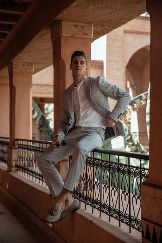 Tan Leather Loafers Outfits For Men: A grey check suit and a white long sleeve shirt are the ideal way to infuse extra elegance into your casual fashion mix. You can get a little creative when it comes to footwear and class up your ensemble by wearing a pair of tan leather loafers.