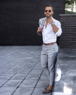 Grey Suit with Long Sleeve Shirt Outfits: We're loving the way this combination of a grey suit and a long sleeve shirt immediately makes a man look sophisticated and sharp. Add a pair of dark brown leather tassel loafers to the mix to pull the whole thing together.