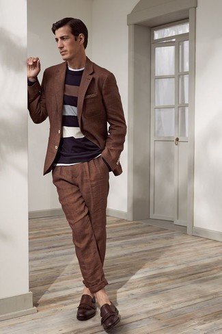 Brown Fringe Leather Loafers Outfits For Men: Such items as a brown suit and a white crew-neck t-shirt are an easy way to inject extra elegance into your day-to-day casual fashion mix. A pair of brown fringe leather loafers will lift up this ensemble.