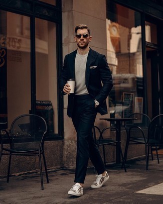 Grey Long Sleeve T-Shirt Outfits For Men: Such must-haves as a grey long sleeve t-shirt and a navy suit are an easy way to inject some rugged refinement into your current casual collection. For a more laid-back finish, why not add a pair of white horizontal striped canvas low top sneakers to the equation?