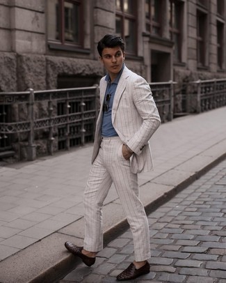 White Vertical Striped Suit Outfits: This smart combination of a white vertical striped suit and a blue polo is extremely easy to pull together in next to no time, helping you look stylish and ready for anything without spending a ton of time going through your wardrobe. For something more on the dressier side to round off your ensemble, complete your ensemble with a pair of dark brown woven leather loafers.