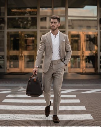 Dark Brown Canvas Duffle Bag Outfits For Men: A beige suit and a dark brown canvas duffle bag are a great combination to keep in your daily casual rotation. Dark brown suede tassel loafers will bring an extra touch of refinement to an otherwise mostly dressed-down outfit.