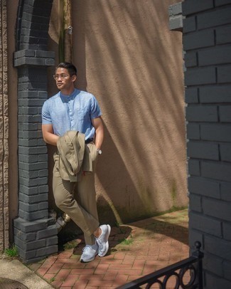Light Blue Short Sleeve Shirt Outfits For Men: This pairing of a light blue short sleeve shirt and a tan suit is a goofproof option when you need to look polished and truly dapper. Let your styling skills truly shine by rounding off this ensemble with a pair of grey athletic shoes.