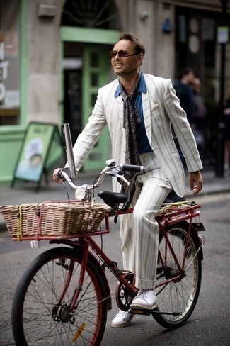 White Vertical Striped Suit Outfits: A white vertical striped suit and a blue short sleeve shirt are an easy way to inject a sense of rugged sophistication into your off-duty styling lineup. Take an otherwise dressy outfit a whole other path by rounding off with a pair of white canvas low top sneakers.