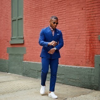 Blue Suit Outfits: Such essentials as a blue suit and a white and red print short sleeve shirt are an easy way to infuse a dash of rugged sophistication into your current styling repertoire. White canvas low top sneakers will bring a fun vibe to this ensemble.