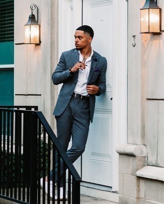 Violet Pocket Square Outfits: For something more on the casually cool end, try teaming a teal suit with a violet pocket square. If you don't know how to finish, introduce white leather low top sneakers to your ensemble.