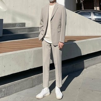 Grey Suit Outfits: This combo of a grey suit and a beige sweater vest is really smart and provides a clean and proper look. A pair of white leather low top sneakers will bring a mellow touch to this ensemble.