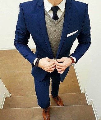 Charcoal Sweater Vest Outfits For Men: Make a head-spinning entrance anywhere you go in a charcoal sweater vest and a navy suit. If you wish to immediately dial down this look with shoes, why not throw in a pair of brown leather derby shoes?