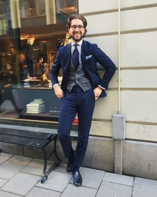 Navy Leather Tassel Loafers Outfits: This combination of a navy suit and a grey sweater vest is a foolproof option when you need to look sophisticated and truly stylish. Round off this ensemble with navy leather tassel loafers to switch things up.
