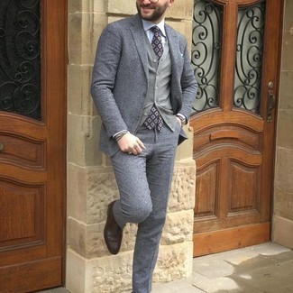 Charcoal Sweater Vest Outfits For Men: Definitive proof that a charcoal sweater vest and a grey wool suit look amazing when matched together in a classy outfit for today's gentleman. We love how a pair of dark brown leather oxford shoes makes this look complete.