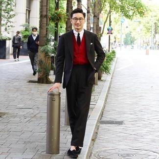 Red and Black Sweater Vest Outfits For Men: A red and black sweater vest and a black vertical striped suit are absolute mainstays if you're picking out a stylish wardrobe that matches up to the highest sartorial standards. Consider black suede tassel loafers as the glue that will tie your look together.