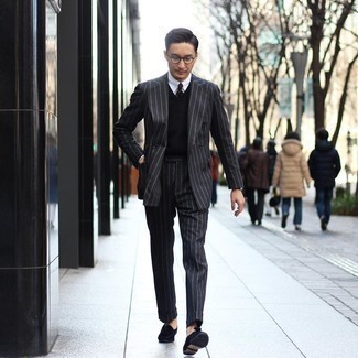 Black Sweater Vest Outfits For Men: This polished combo of a black sweater vest and a charcoal vertical striped suit is a frequent choice among the stylish guys. Let your sartorial prowess really shine by finishing off your ensemble with a pair of black suede tassel loafers.