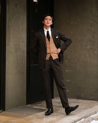 Tan Sweater Vest Outfits For Men: Pairing a tan sweater vest with a dark brown suit is an on-point idea for a dapper and sophisticated getup. In the footwear department, go for something on the relaxed end of the spectrum with black leather loafers.