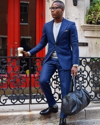 Navy Suit Outfits: Make a navy suit and a grey sweatshirt your outfit choice to look like a contemporary gent. Infuse an extra dose of style into your look by rocking a pair of black leather derby shoes.