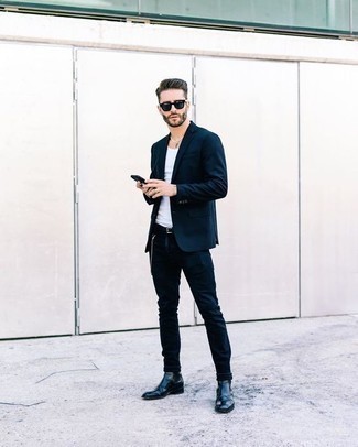 White Tank Outfits For Men: A white tank and a navy suit married together are the ideal ensemble for those who appreciate effortlessly neat styles. Bump up the cool of your look by wearing black leather chelsea boots.