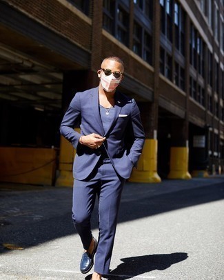 Navy Suit Outfits: The go-to for a neat and stylish ensemble? A navy suit with a navy tank. For maximum style, introduce a pair of navy leather loafers to the equation.