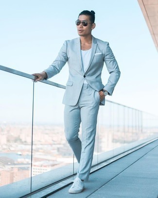 Light Blue Suit Outfits: Putting together a light blue suit and a white tank is a surefire way to breathe elegance into your day-to-day routine. For something more on the off-duty end to round off this outfit, slip into white canvas low top sneakers.