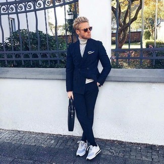 Light Blue Athletic Shoes Outfits For Men: This polished combination of a navy suit and a white turtleneck is a common choice among the dapper men. For something more on the casual end to finish off your getup, introduce light blue athletic shoes to this outfit.