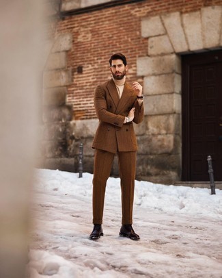 Tan Knit Wool Turtleneck Outfits For Men: You'll be surprised at how super easy it is to put together this sophisticated ensemble. Just a tan knit wool turtleneck and a brown wool suit. Complement this ensemble with a pair of dark brown leather casual boots to infuse a hint of stylish nonchalance into this look.