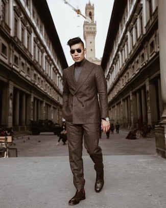 Charcoal Turtleneck Outfits For Men: For rugged sophistication with a contemporary spin, marry a charcoal turtleneck with a brown suit. On the shoe front, this look is rounded off really well with dark brown leather chelsea boots.