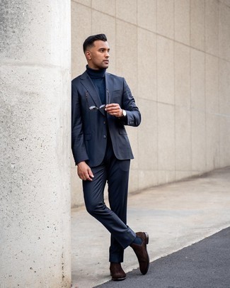 Dark Brown Suede Chelsea Boots Outfits For Men: This combo of a navy suit and a navy wool turtleneck speaks rugged refinement. The whole getup comes together perfectly if you complete your look with dark brown suede chelsea boots.