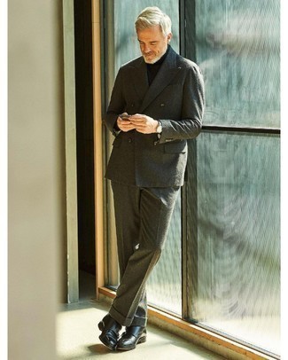 Olive Wool Suit Outfits: We love how this combo of an olive wool suit and a black turtleneck instantly makes men look dapper and classy. As for footwear, complement this look with black leather double monks.